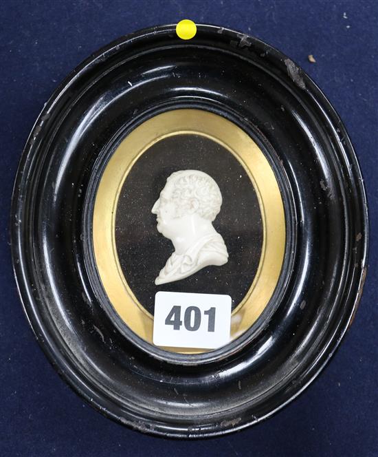 A Regency carved ivory profile relief of a Roman emperor, in ebonised and gilt oval frame 2in.